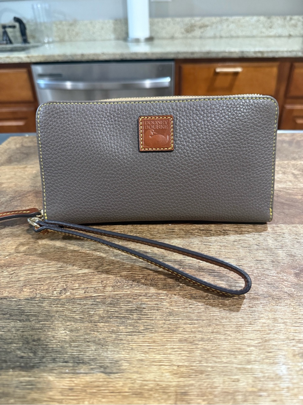 Dooney and Bourke Pebble Grain Leather Large Wristlet in Taupe Color